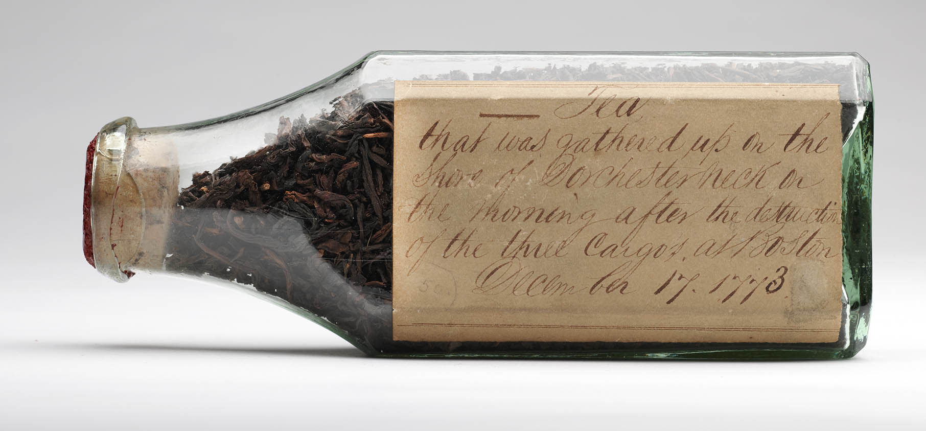 Tea leaves in glass bottle collected on the shore of Dorchester Neck the morning of 17 December 1773
