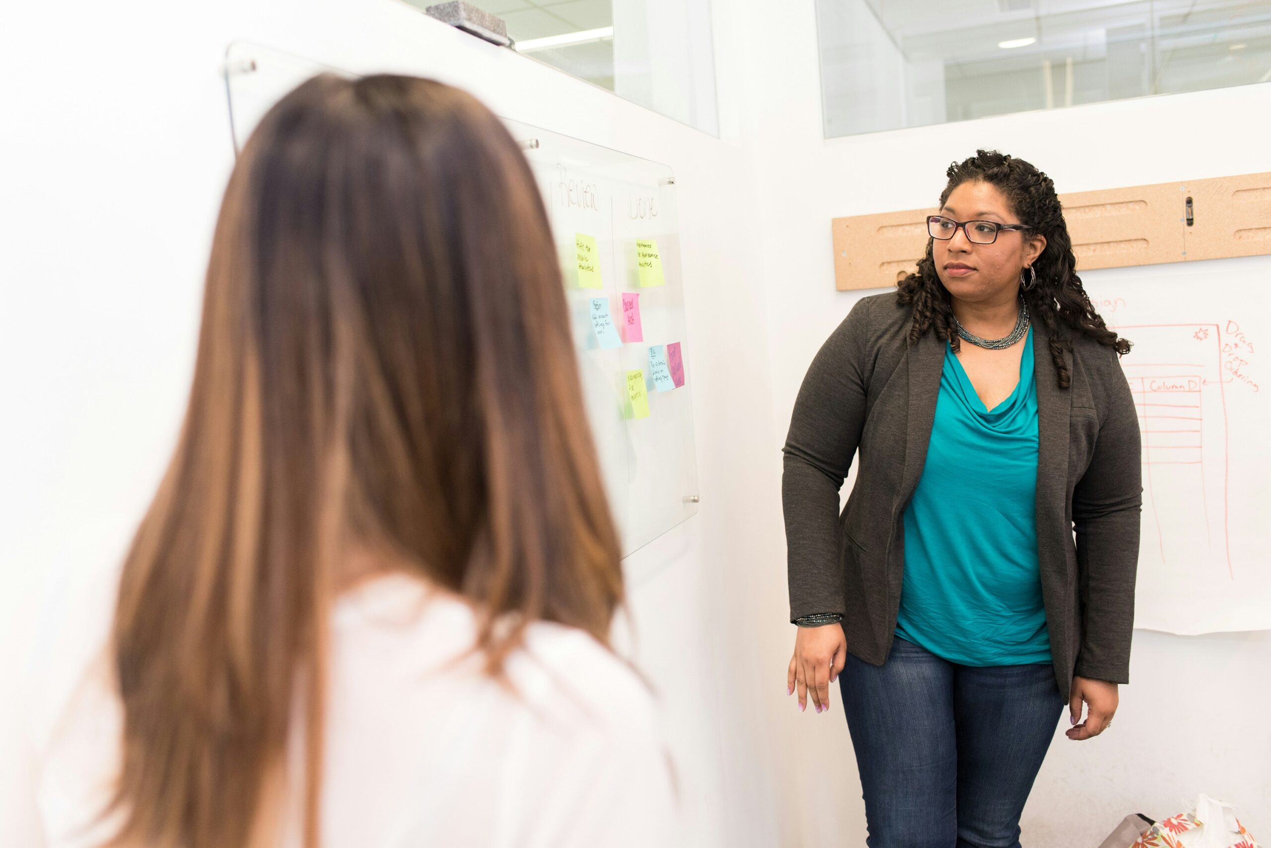 Two teachers at an ideas board