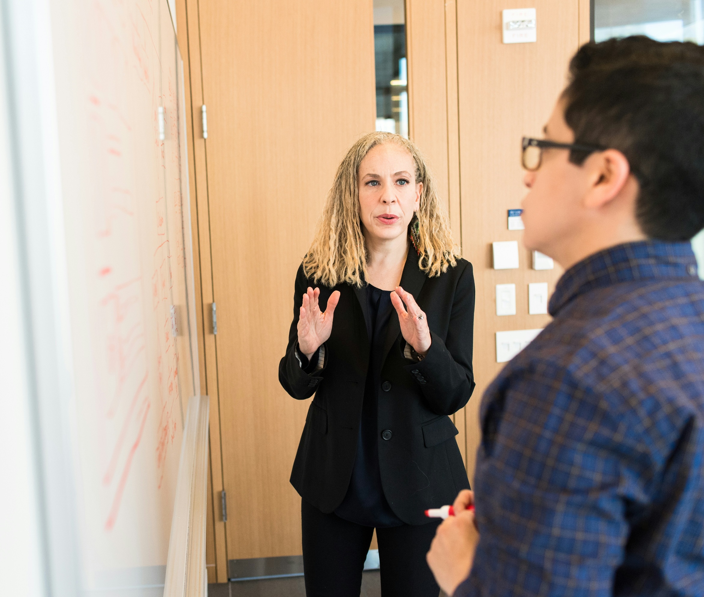 Two teachers at a whiteboard 